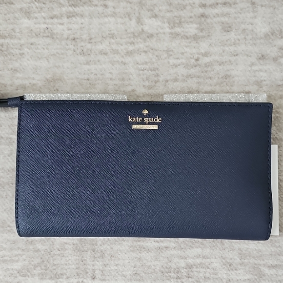 kate spade Handbags - kate spade navy zip-around saffiano wallet with gold logo
